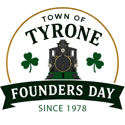 Founders Day Logo featuring a train, shamrocks and ribbon with gold semi-circle