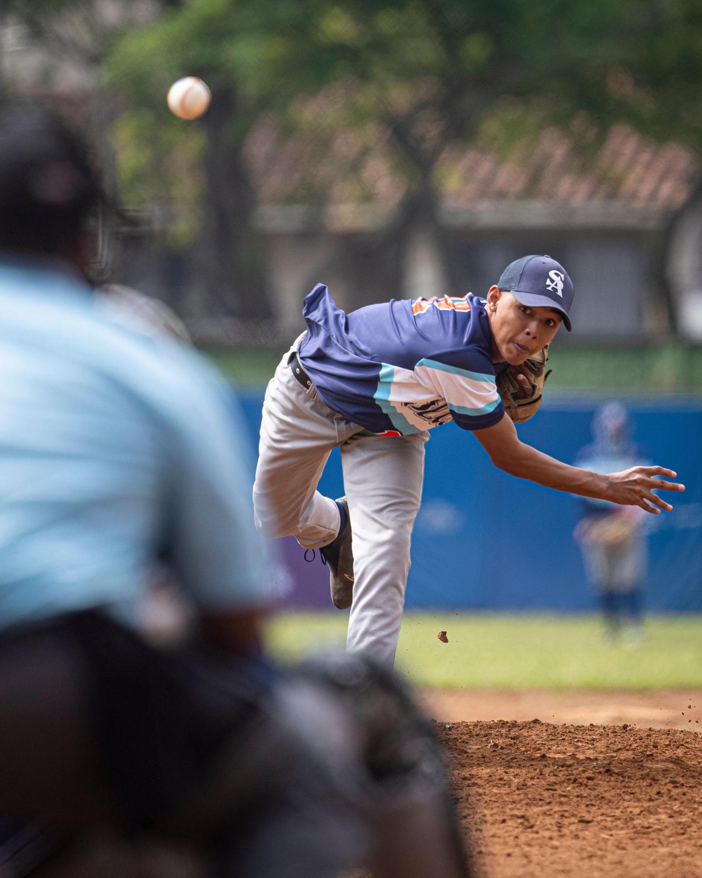 Youth baseball player pitching during a game.